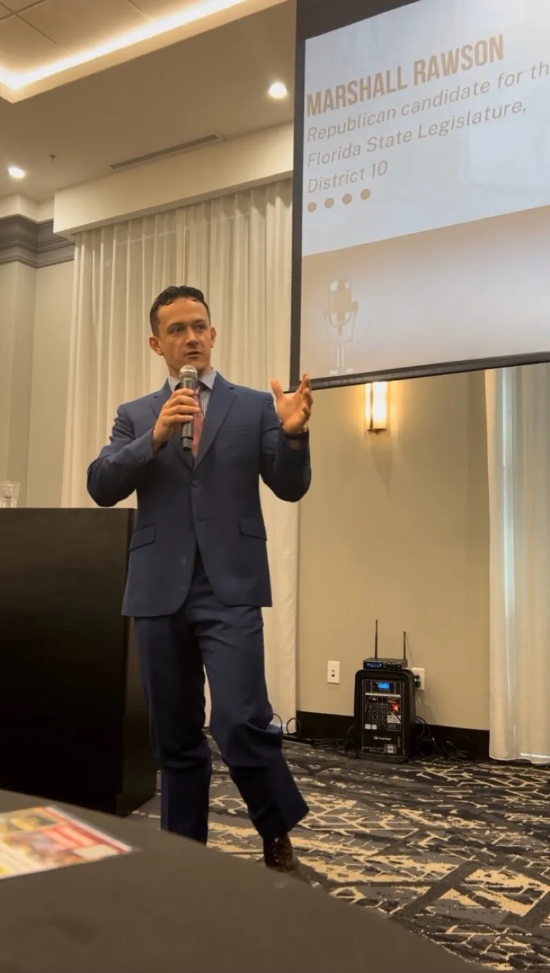 Marshall speaking at an event