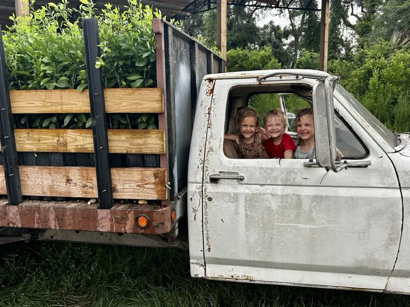 The Rawson kids in the farm truck